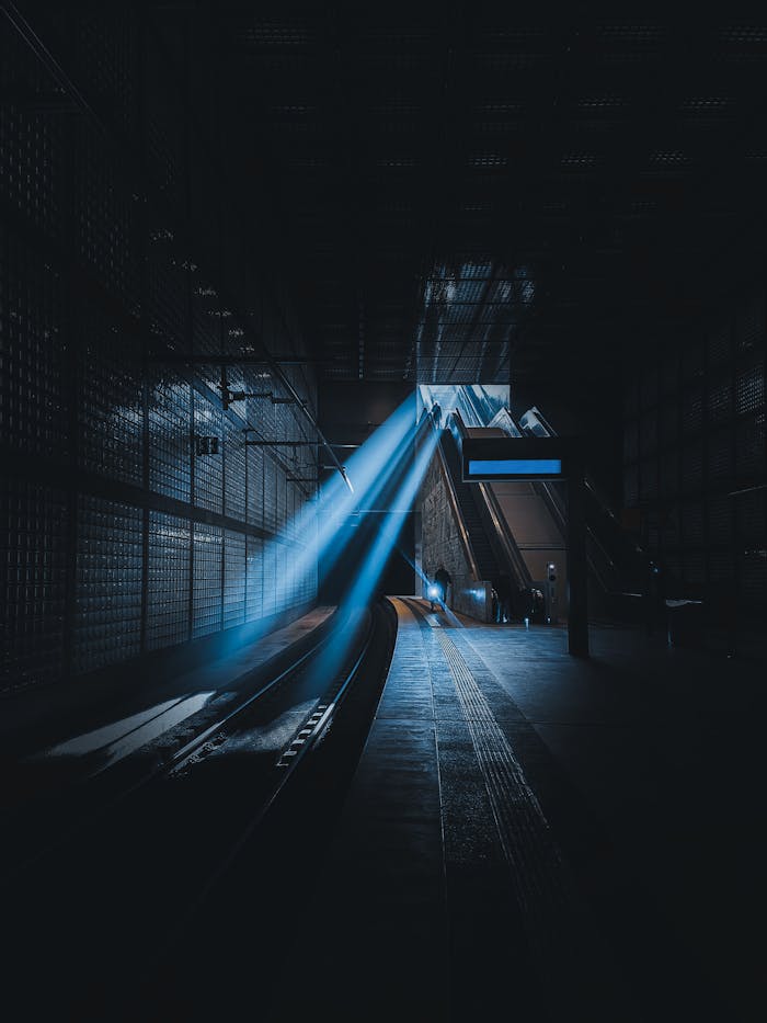 Moody rays making escalators in a Leipzig subway station appear dramatic.